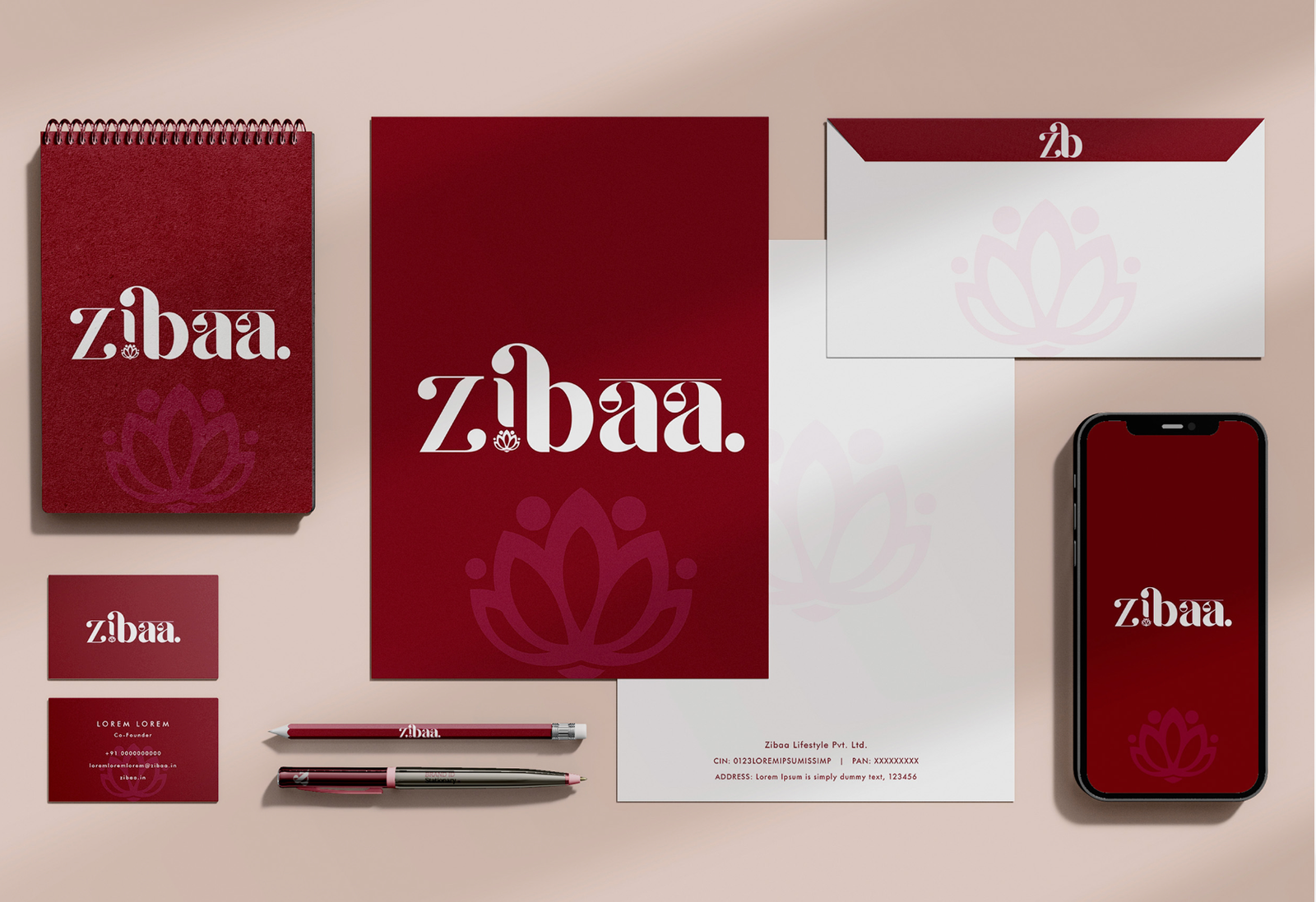 Zibaa brand identity mockup on packaging and stationery with maroon lotus logo, branding by The Design Aura